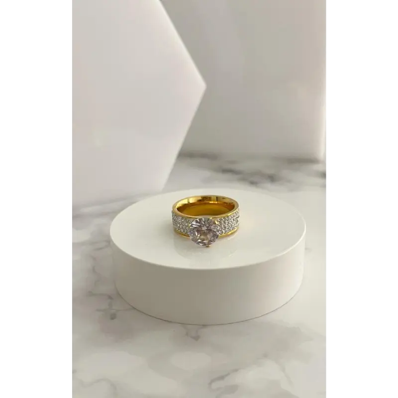 ANILLO EN ACERO DORADO CON CIRCÓN Y BOLA DE FUEGO