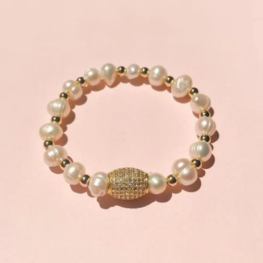 PULSERA EN PERLA DE RIO CON APLIQUE EN COVER GOLD